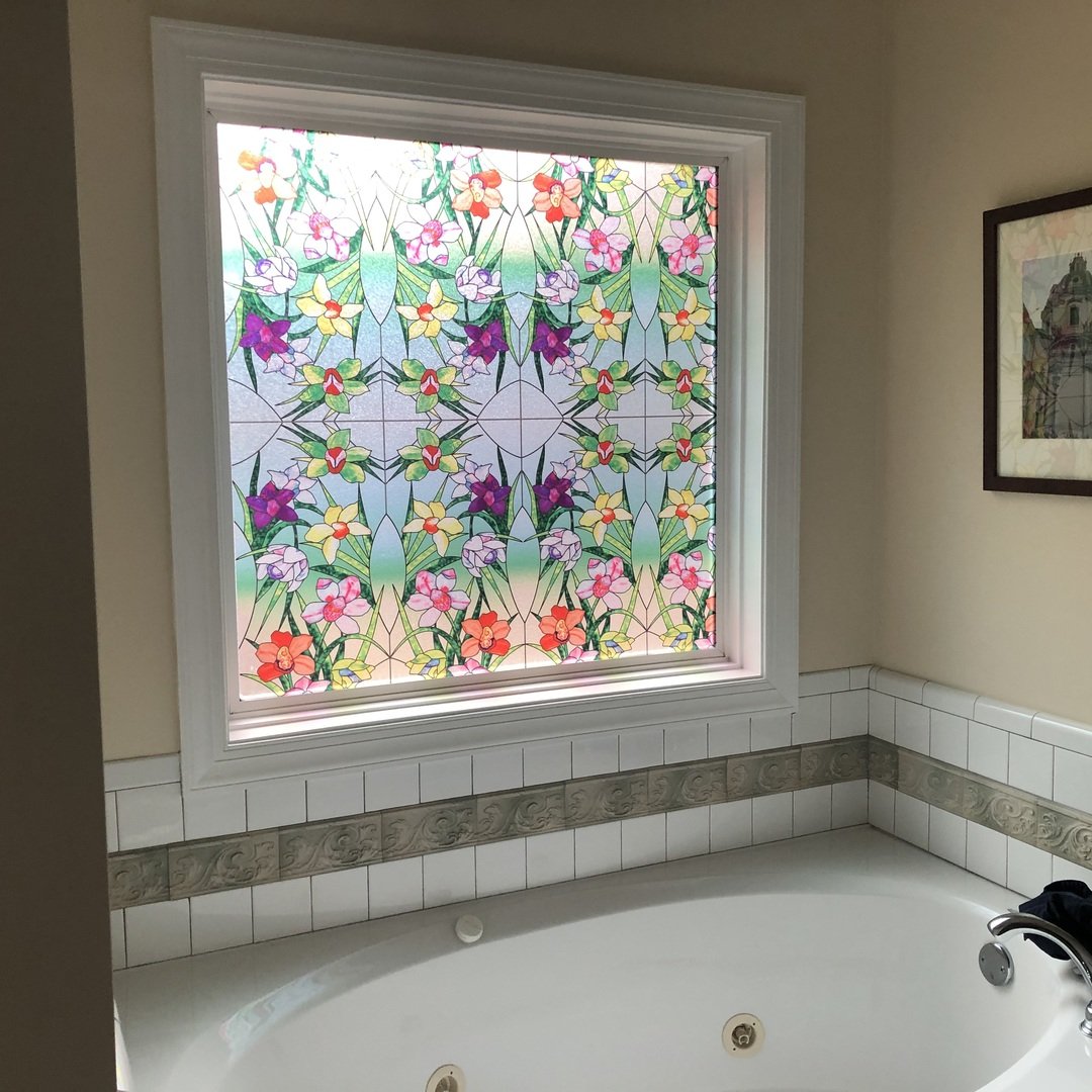 Large bathroom window with SXEG-4848 Stained Glass Flowers colorful floral film above soaking tub